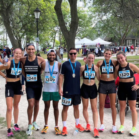 people with medals after a race