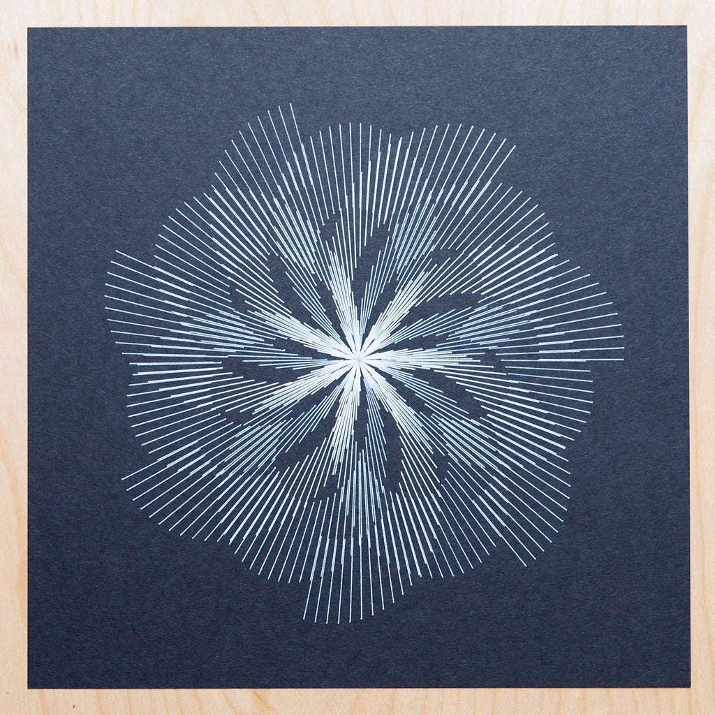 phyllotaxis code art by michelle chandra of dirt alley design drawn with axidraw pen plotter using white gelly roll on black paper