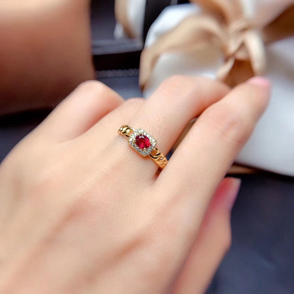 gold ring with garnet stone