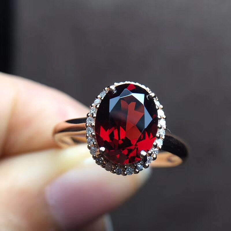 gold ring with garnet stone