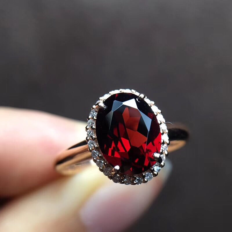 gold ring with garnet stone