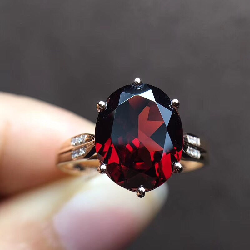 gold ring with garnet stone