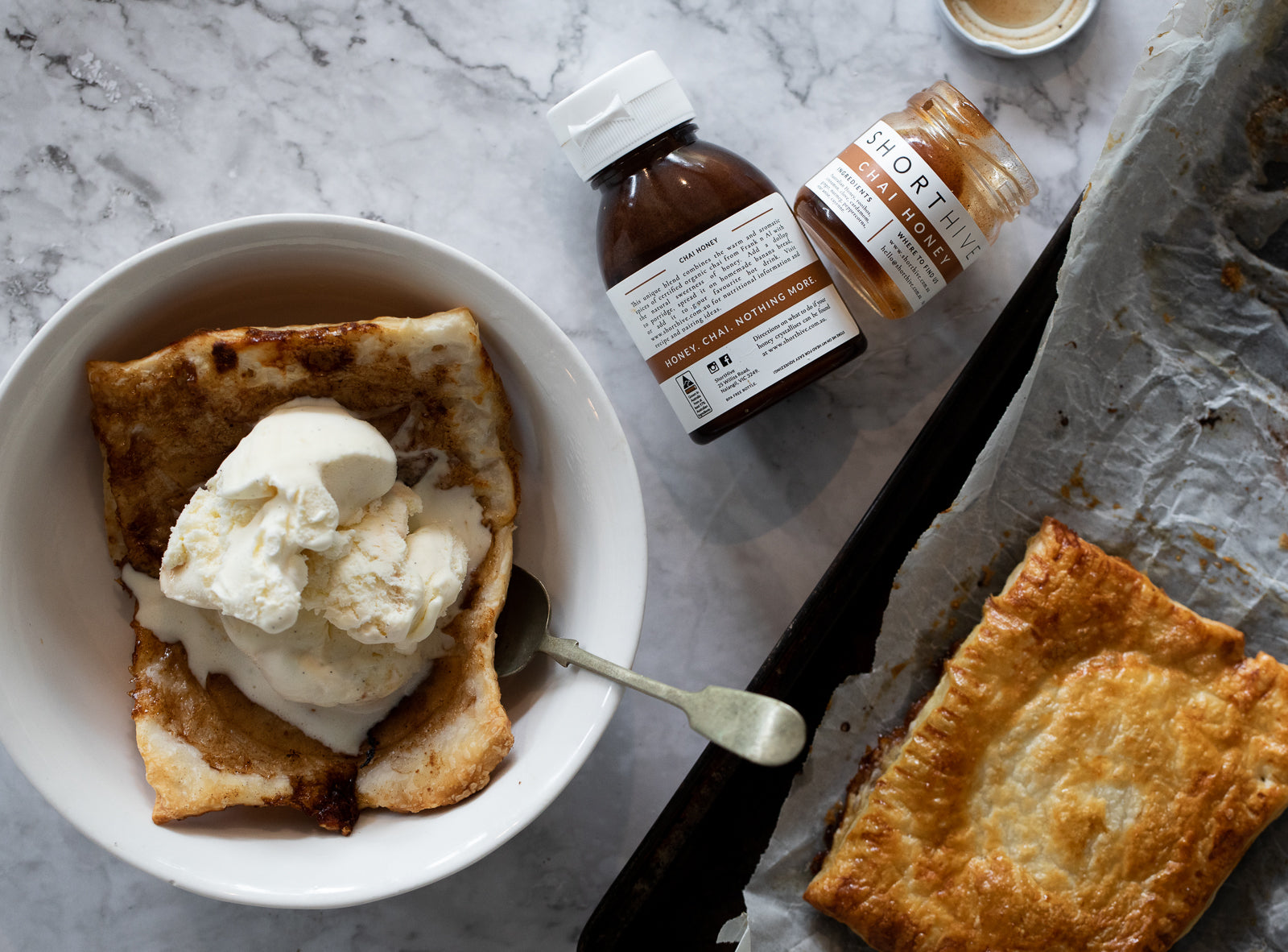 Chai Honey Apple Tart in bowl with icecream and ShortHive Honey