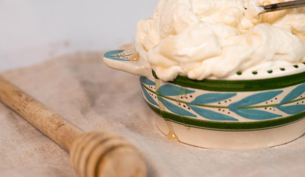 ShortHive recipe of Salted Honey Whipped Cream in a blue and green bowl