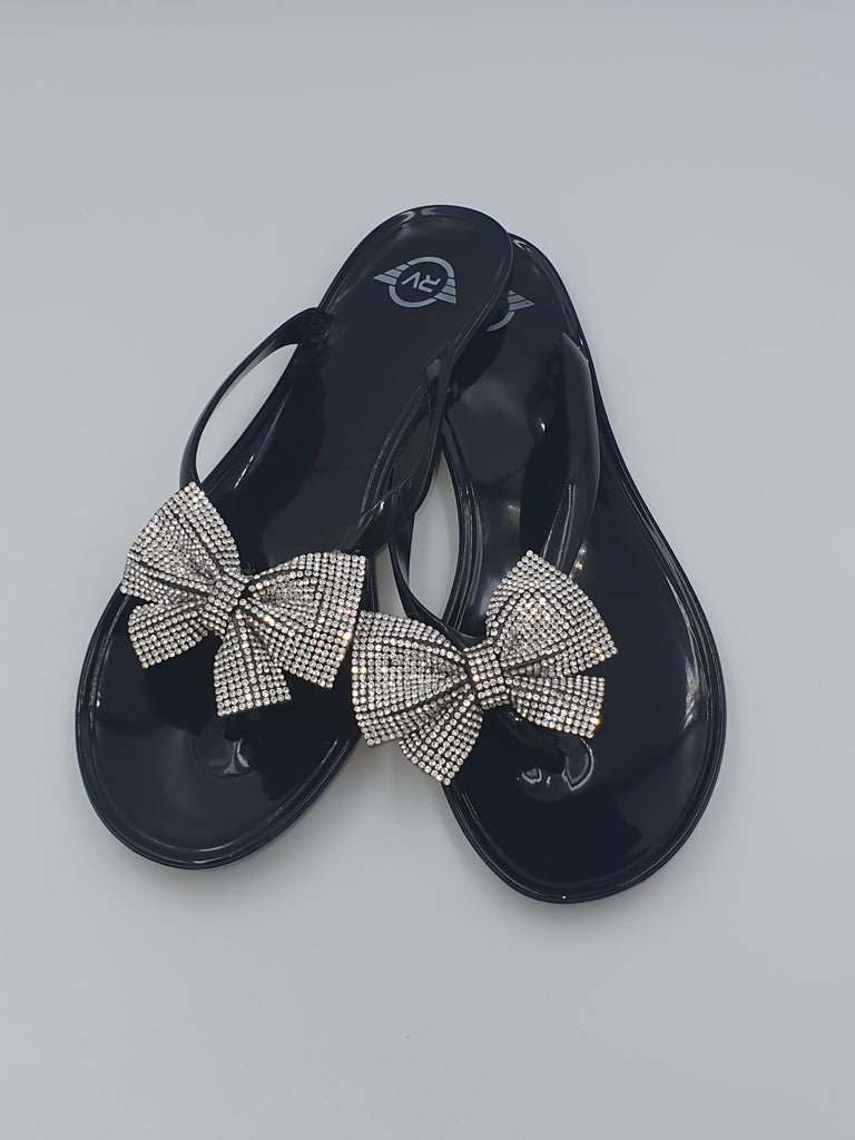 black jelly flip flops with bow