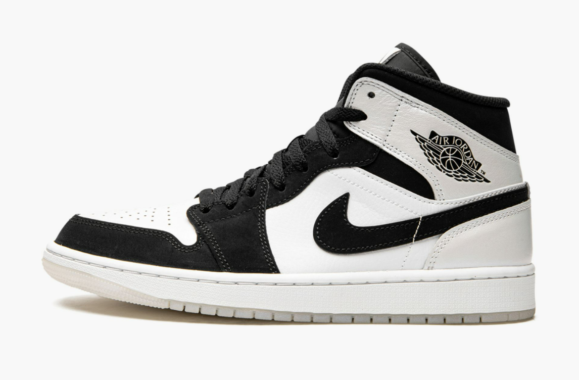 black white jordan mid 1