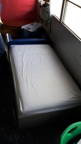 napping cot inside family resources on the go bus