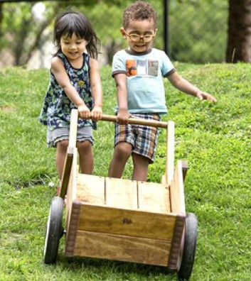 outlast wheelbarrow with two children in childcare