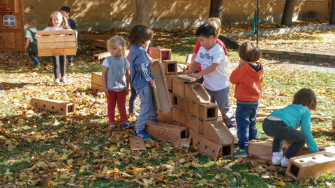 children with outlast outdoor blocks STEM childcare early years classroom