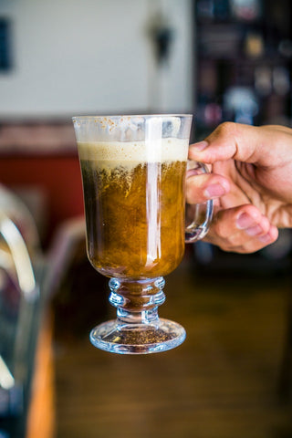 Irish coffee in a latte glass