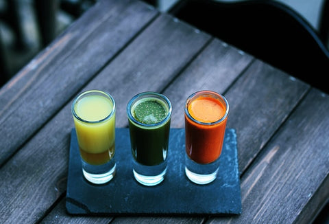 Yellow, green, orange alcoholic shots