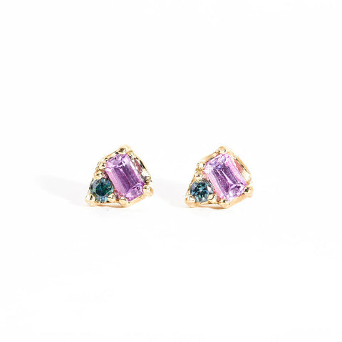 A pair of Wink Sapphire Earrings featuring a pink Ceylon sapphire and blue Australian sapphire on 9 carat gold