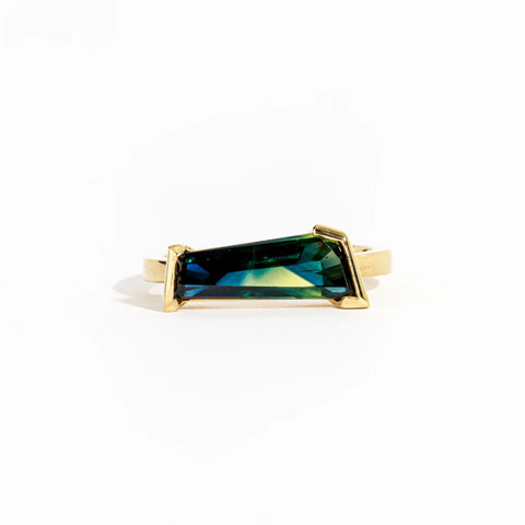 Freeform cut 2.86ct ethically sourced Australian blue/green parti sapphire on an 18 carat yellow gold band