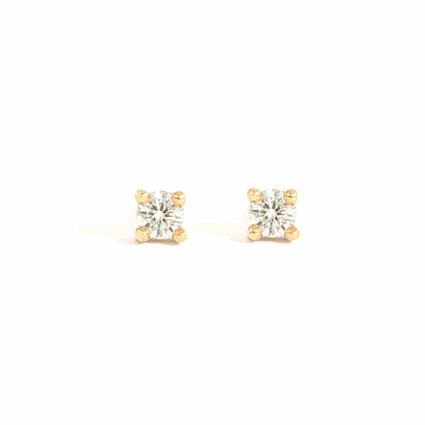 Two 3mm round brilliant cut white diamonds on 9ct yellow gold earring backs
