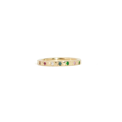 Brilliant cut mixed diamonds, colourful sapphires and tsavorite garnets set on a gold band.