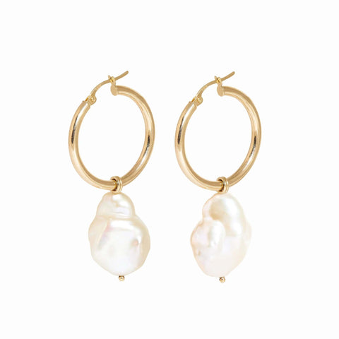 Two gold hoop earrings with white baroque pearl