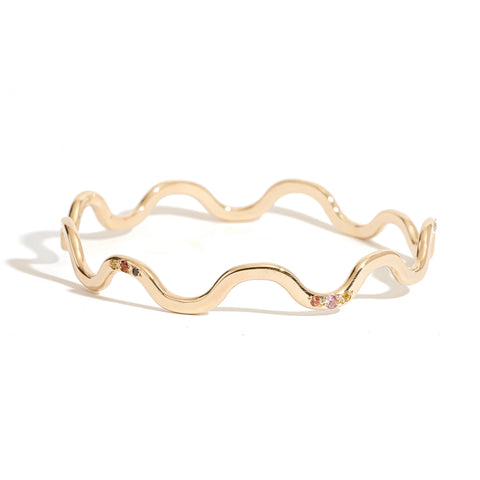 Gold Flow Bangle with contoured curves and coloured sapphires