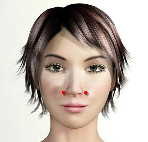 computer generated face of a woman with two red dots on the sides of her nostrils