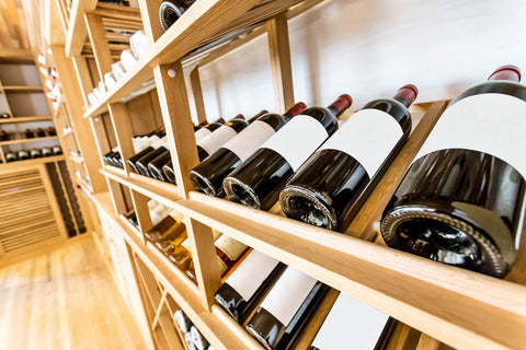 wooden wine rack with wine bottles