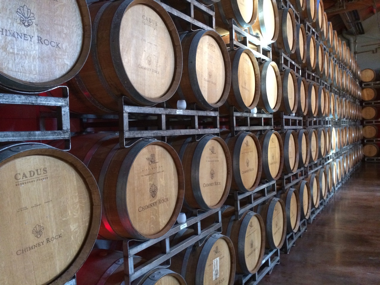 Rows of Cadus wine barrels