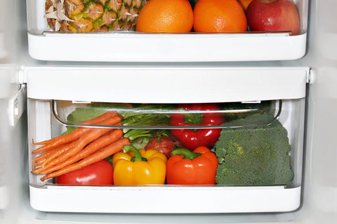 Refrigerator with fruits and vegetables in it