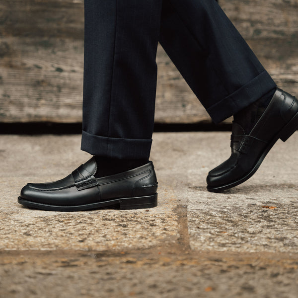 Men’s black leather slip on Penny Loafers | Velasca