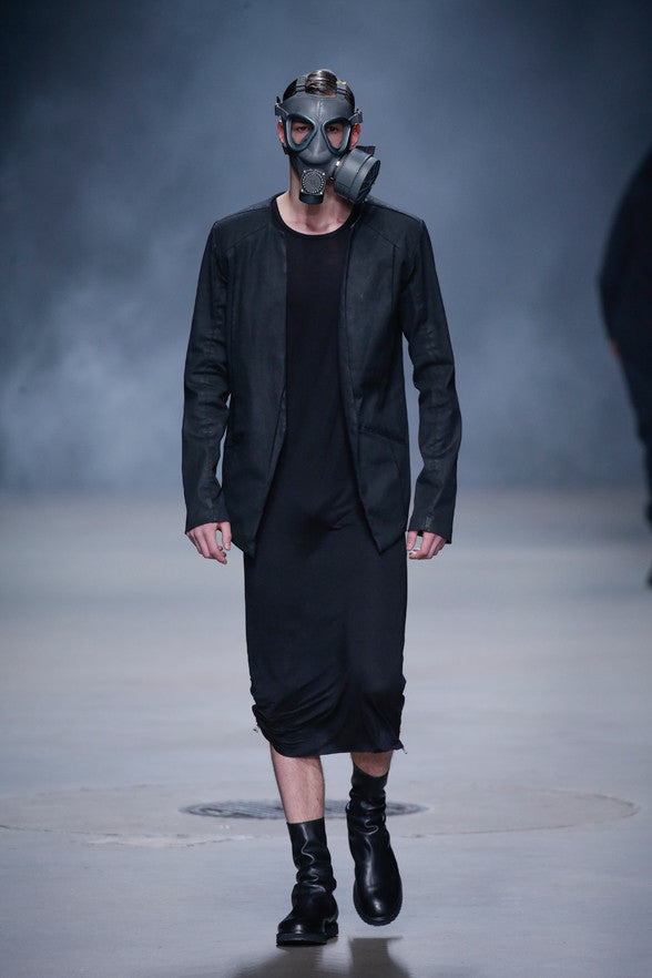 er 2016 Show during Amsterdam's Mercedes Benz Fashion Week. With the continuation of their typical monochrome colour palette, Swedish design duo Daniel Wahlberg and Richard Sjöblom creates yet another arcane collection adding to the mystery with the use of gas masks. Drop-crotch pants, asymmetrical tops, oversized outerwear combine with structured tailored pieces and leather accessories in a variety of wearable yet conceptual forms. The designer duo continues the evolution of their original concept, "combining classic designs from the west with avant-garde fashion from the east."
