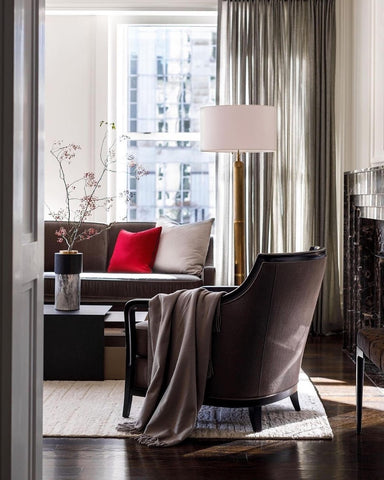 Neutral toned living space featuring a Tufenkian rug