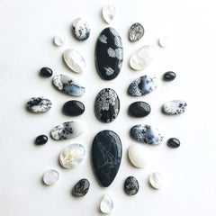 An image of the gemstones used in the collection arranged in a mandala pattern