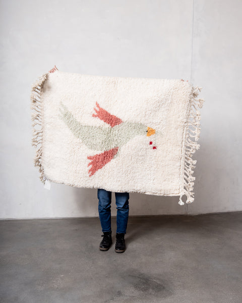 100% sheep's wool berber rug with bird design.