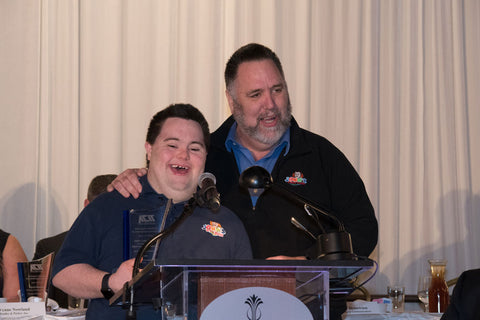 John and Mark speaking at an event