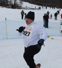 John competing in Special Olympics Snowshoe
