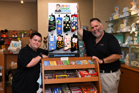 John and Mark with their socks in a store