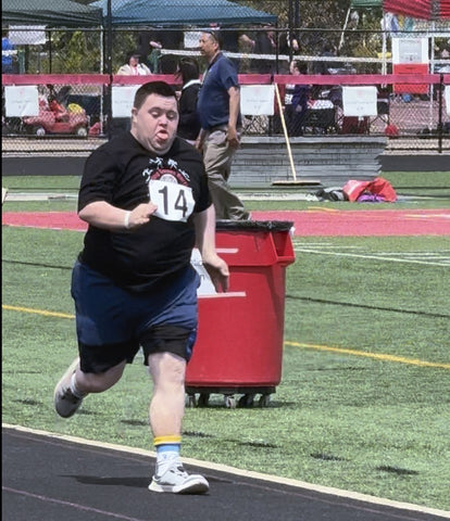 John running hard in the Special Olympics