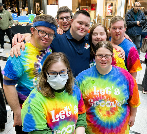 John with fans at World Down syndrome day event 