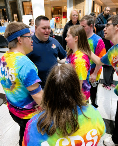 John talking with fans at World Down syndrome day event 