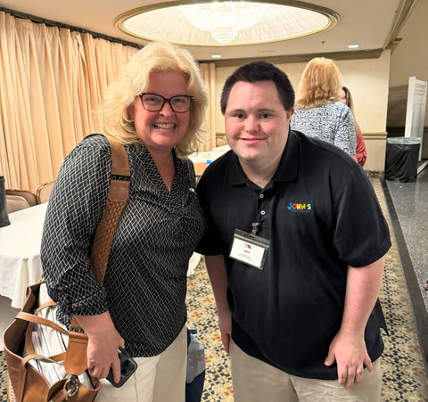 JOhn with a fan after his keynote address