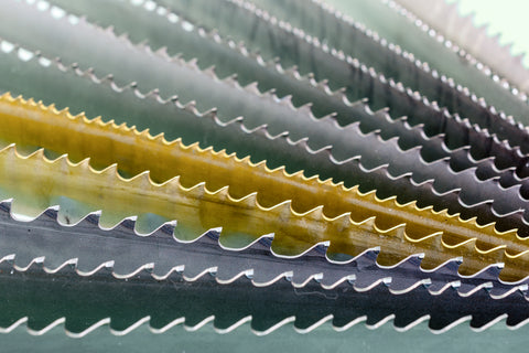 close-up photo of a multitude of different saw blade teeth