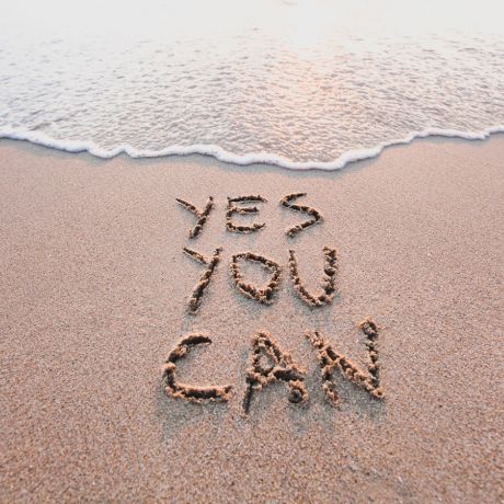 motivational writing in sand