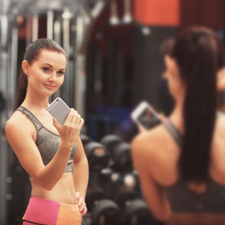 woman taking selfie at the gym