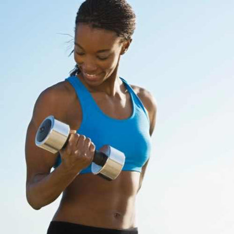 Sport Women doing Fitness with Dumbbell Biceps Curl to Shoulder
