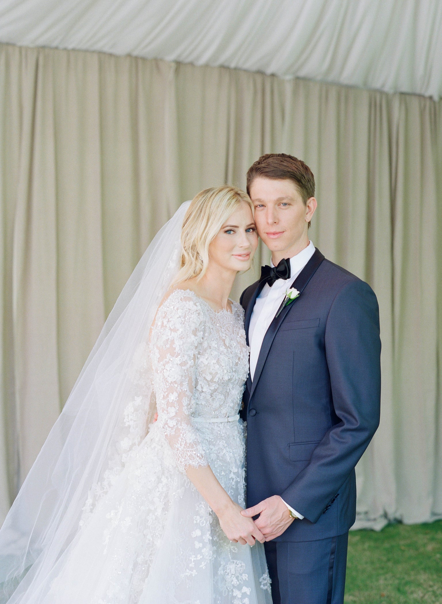 Bride and groom pose after marriage. Bridal makeup by Valerie. Valerie created a soft rose gold eye using Lovee Paw Print Eyeshadow kit.
