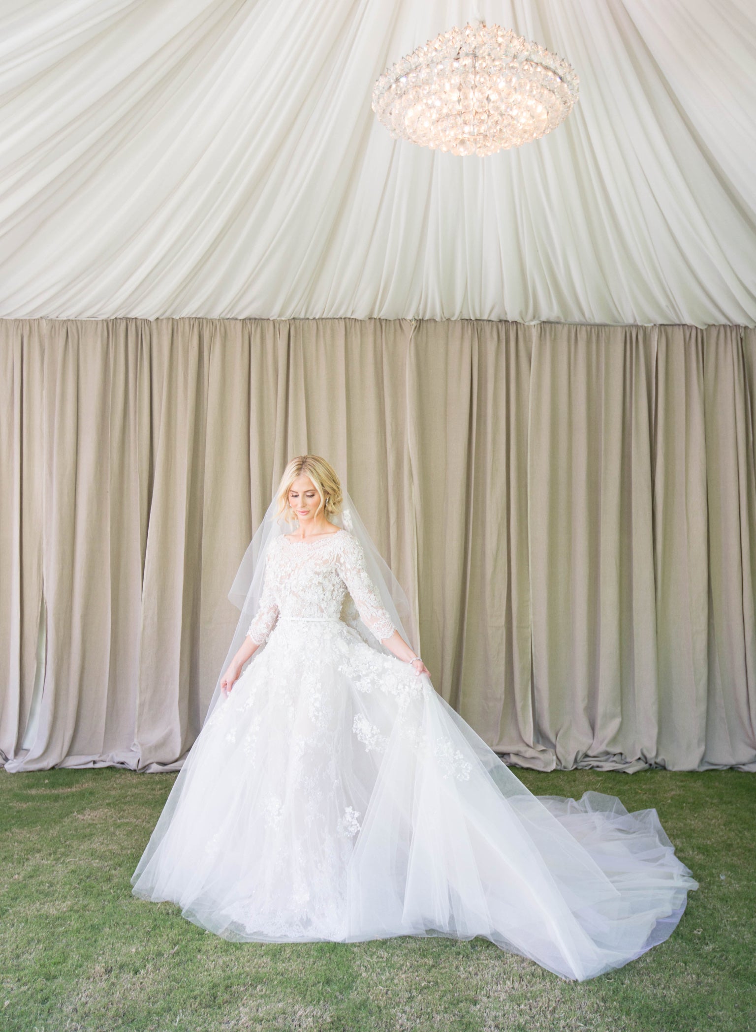 Bride shows off her elegant wedding dress.