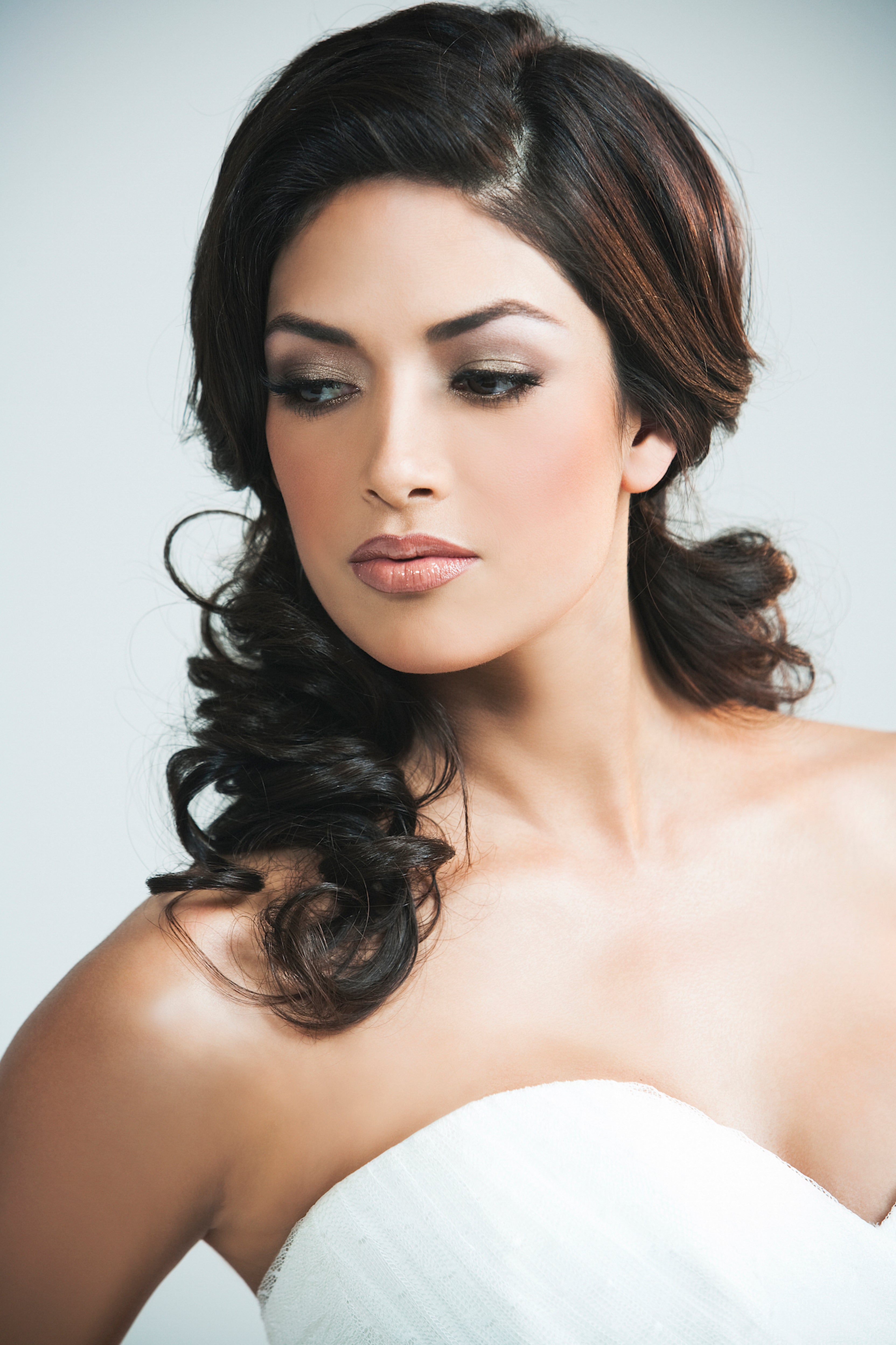 Image of Nicole Phelps. Makeup by Valerie. Valerie created a more dramatic bridal looking using Celine Paw Print Eyeshadow kit, Golden Sherbet Cream Eyeshadow, Sorrell Lip Liner, and Cougar Lipgloss.
