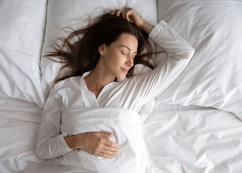 Woman Sleeping in Bed