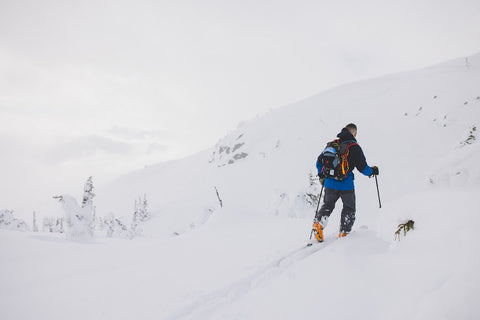 ski touring in the mountains with a gogglesoc goggle cover