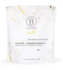 A coconut and vanilla mineral bath soak in a white, luxe-looking resealable sachet against a white background. 