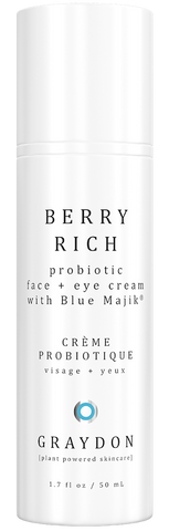 A blue-hued probiotic face cream in a white bottle against a white background