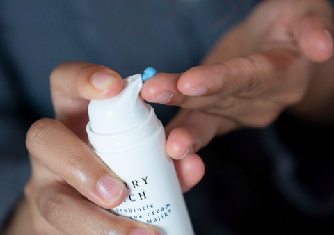 Bright blue Berry Rich being applied to finger