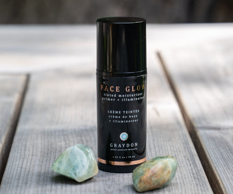 Face Glow tinted moisturizing skin primer on a deck